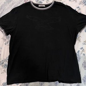 Xl black junk food brand eagles tee with white ring sleeves.